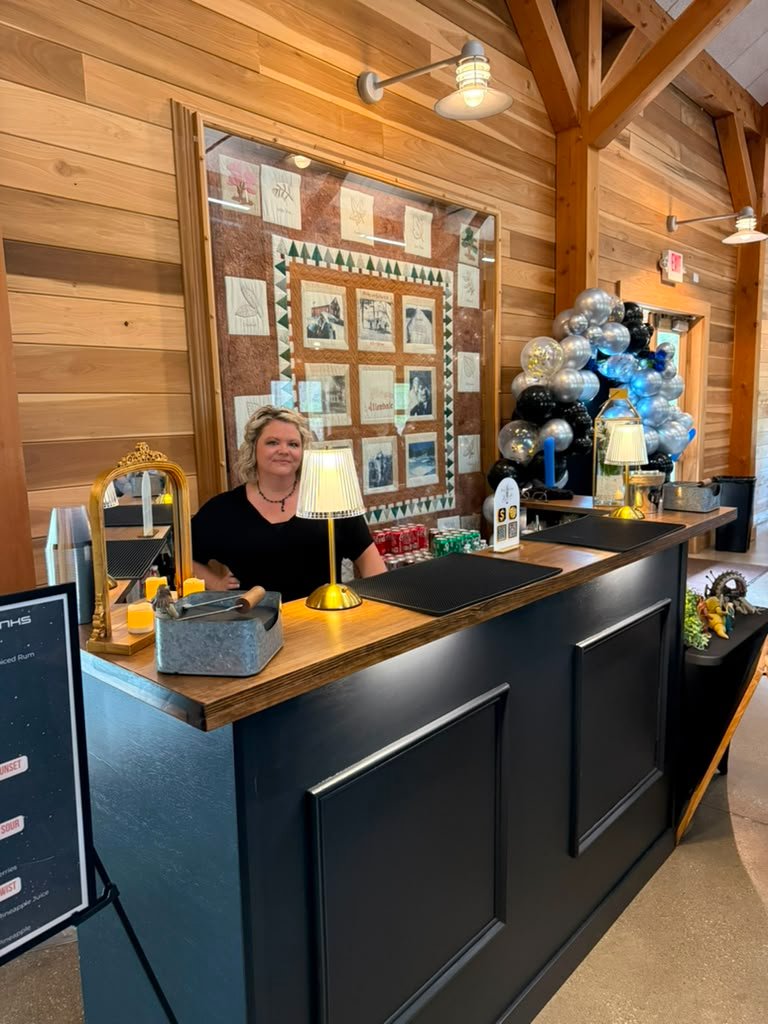 Wild Bloom & Bubbles full bar setup with signature drinks sign